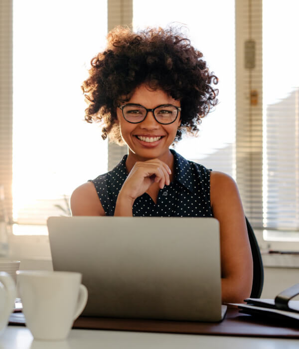 Woman With Laptop Smiling